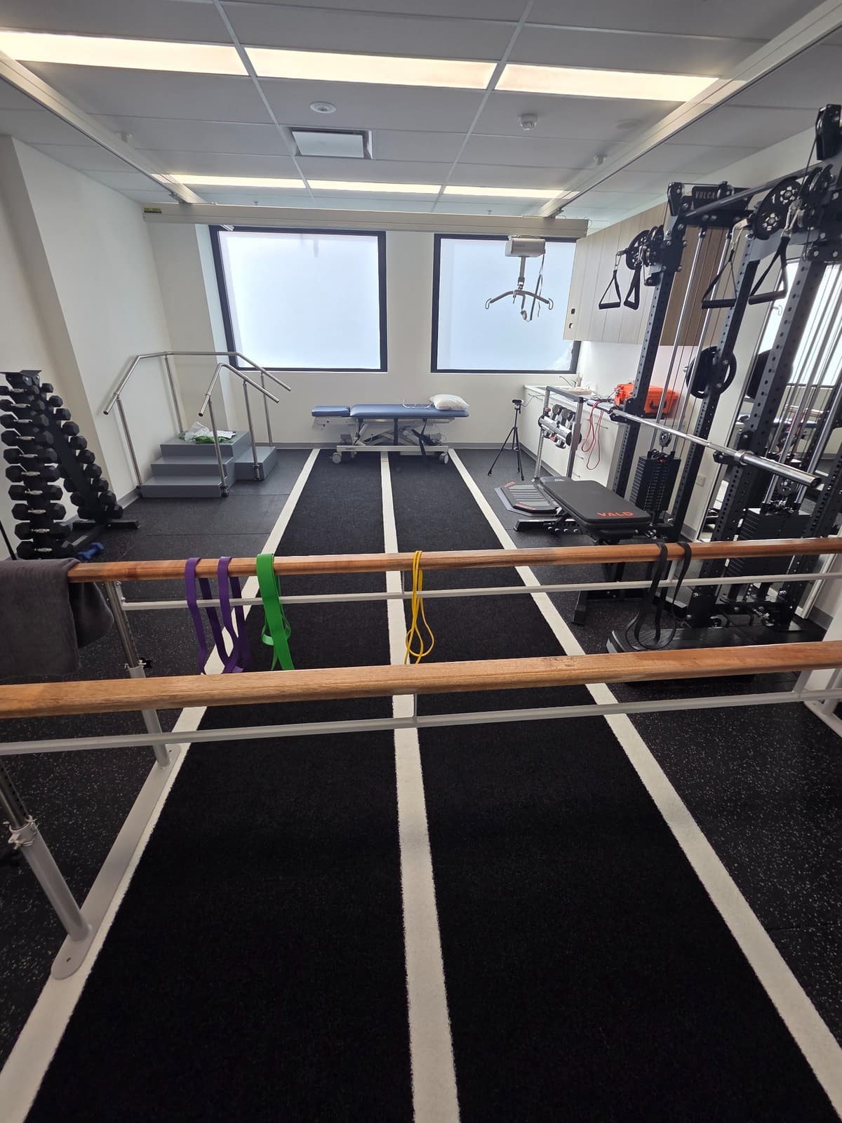 Exercise space with parallel bars and cable machine at Nepean Advanced Rehab