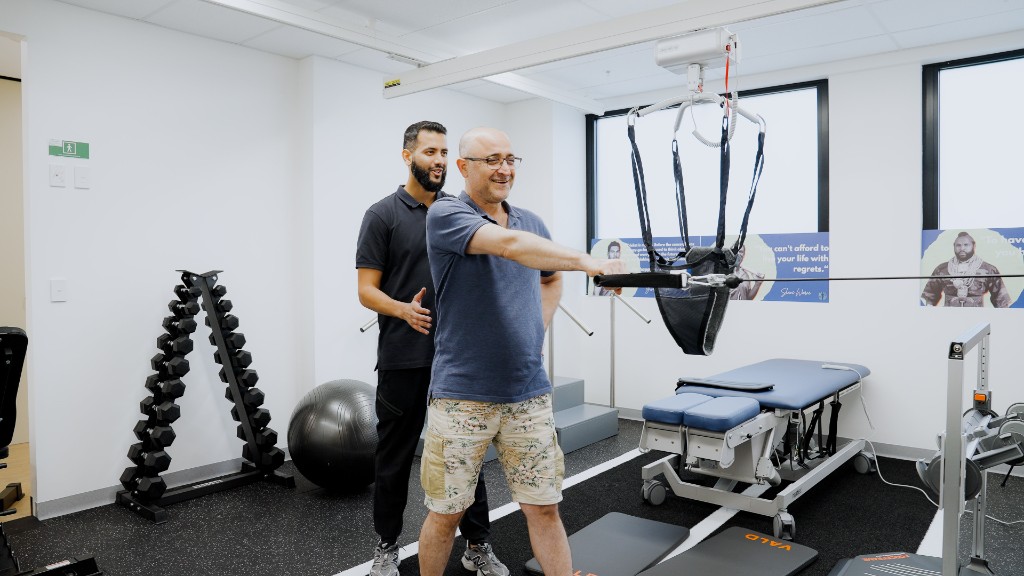 Physiotherapist working one-on-one with a patient during a rehabilitation session
